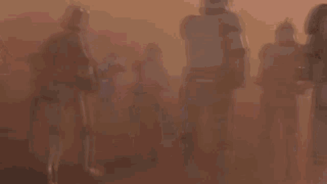 a group of clone troopers are standing in a foggy field