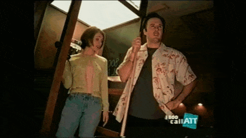 a man and a woman are standing next to each other in a room with the words call att on the bottom