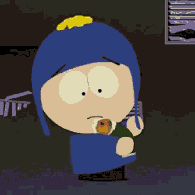 a cartoon character from south park is holding a guinea pig in his arms .
