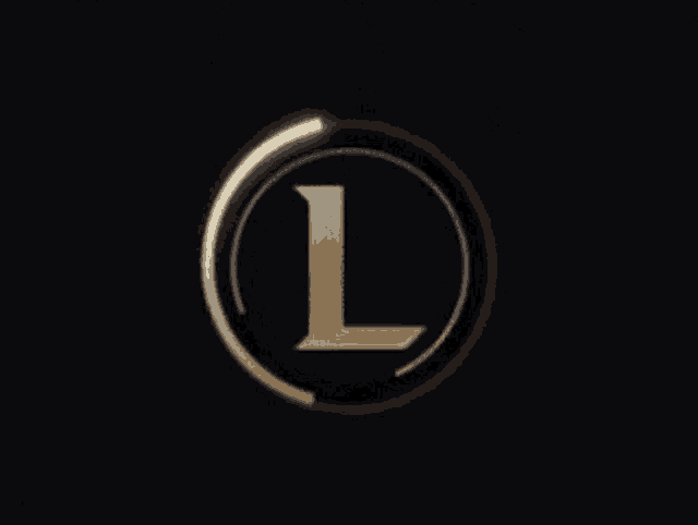 a gold letter l in a black circle