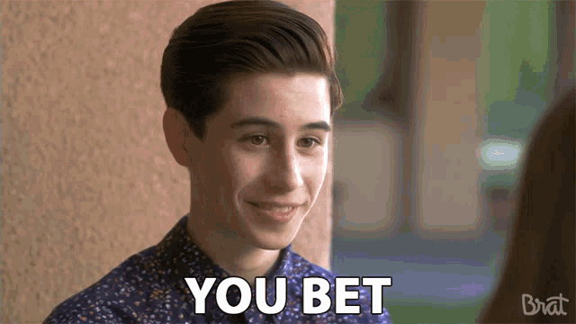 a young man in a blue shirt says you bet