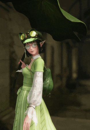 a girl in a green dress is holding a black umbrella