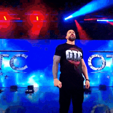 a man in a t-shirt that says otc on it