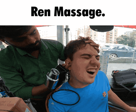 a man in a blue shirt is getting a ren massage from a man in a green shirt