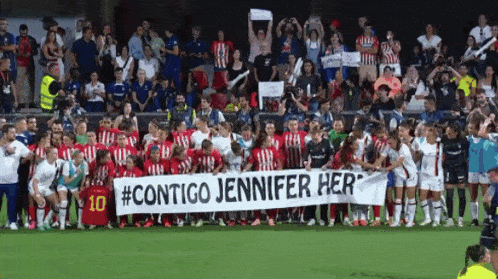 a soccer team holds a banner that says #contigo jennifer her