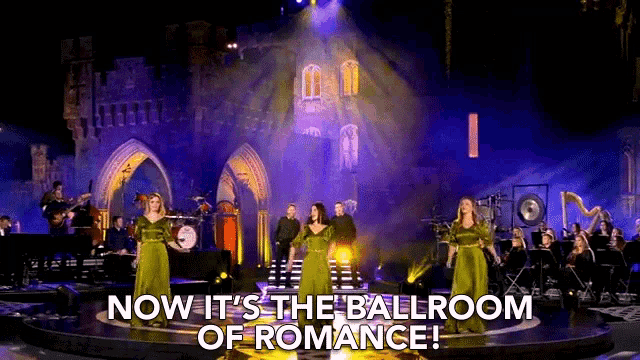 a group of women singing on a stage with the words " now it 's the ballroom of romance "