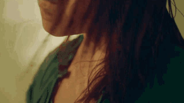 a close up of a woman 's neck and shoulder