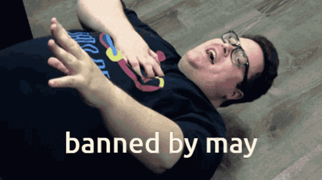 a man is laying on the floor with the words banned by may written on the bottom