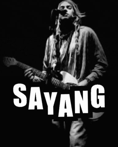 a black and white photo of a man singing and playing a guitar with the word sayang in white