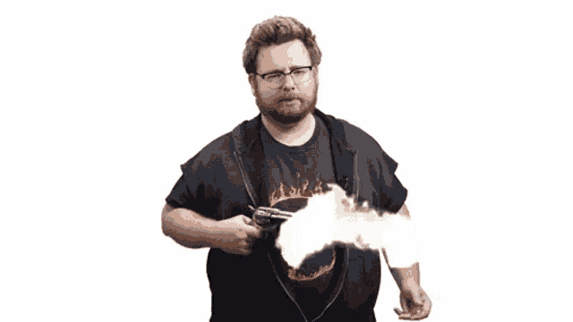 a man with a beard is holding a gun