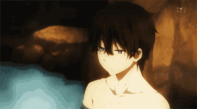 a boy in a bathtub with tokyo mx on the bottom