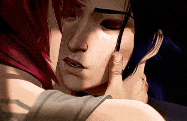 a close up of a woman touching a man 's face with her hand