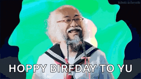 a man with glasses and a beard is wearing a sailor suit and says hoppy biredayo yu