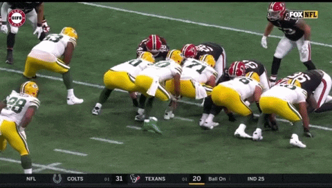 a football game is being played between the green bay packers and alabama crimson tide