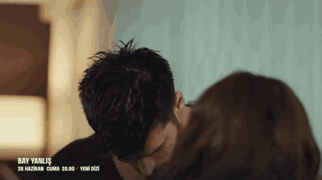 a man and woman are kissing in a scene from bay yanli