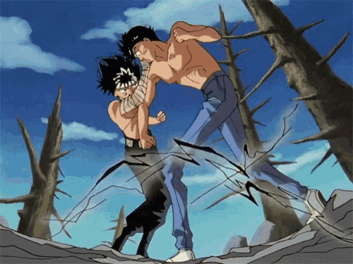 a man without a shirt kicks another man in the face