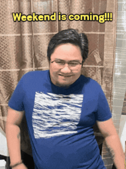 a man in a blue shirt with the words weekend is coming