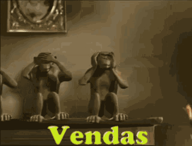 two statues of monkeys sit on a shelf with the number 1197991-9285 on the bottom