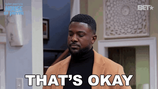 a man in a suit says that 's okay on a screen