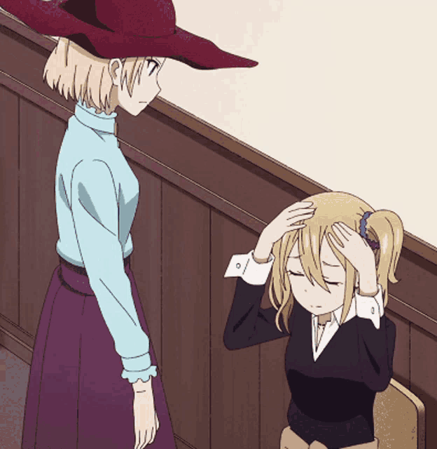 a woman in a red hat is standing next to a girl with her eyes closed