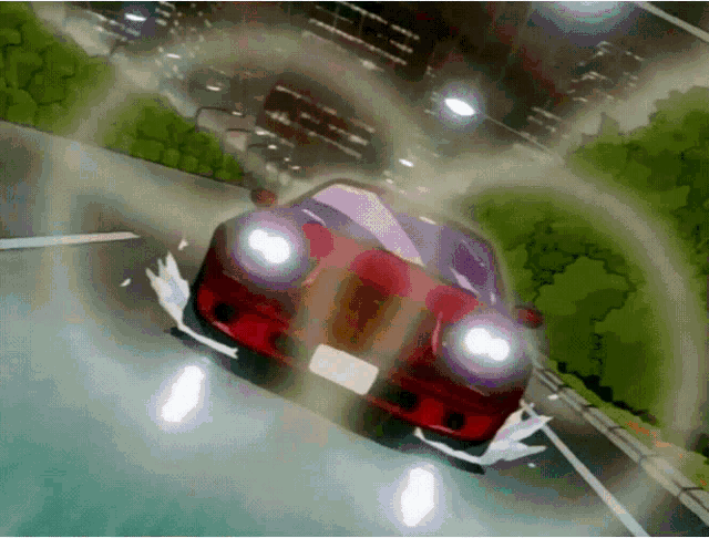 a red car with a license plate that says ' a ' on it is driving down a road