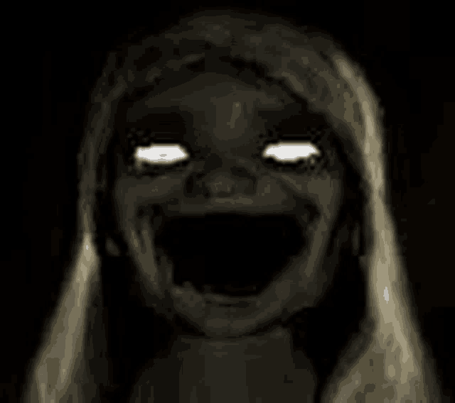 a black and white photo of a scary girl with glowing eyes and mouth .