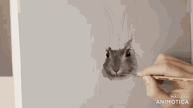 a person is painting a rabbit with a brush and the words made in animotica are visible behind them
