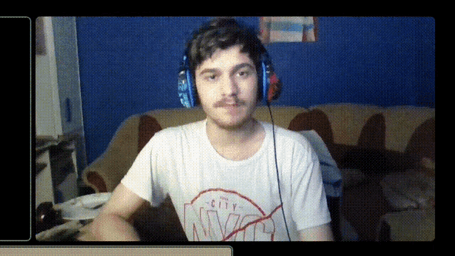 a man wearing headphones and a white shirt that says nyc