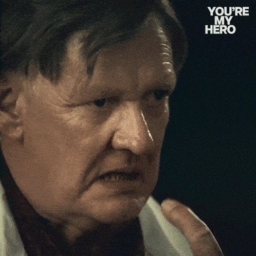 a close up of a man 's face with the words " you 're my hero " below him