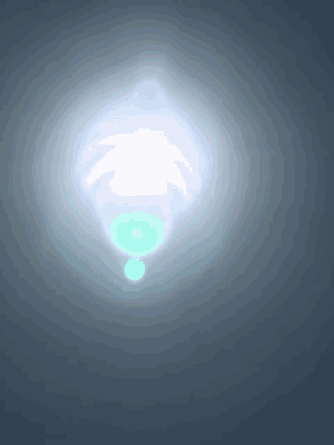 a bright white light with a green circle in the middle