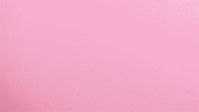 a girl with blonde hair and blue eyes laying on a pink blanket