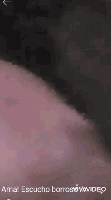 a close up of a person 's face with the words " ama escucho borroswvvideo " on the bottom