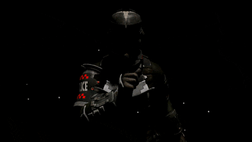 a police officer is holding a gun in his hand