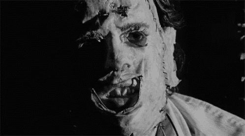 a close up of a person 's face with a stitched mask on it .