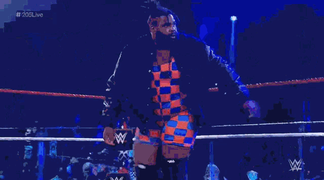 a wrestling ring with a w logo on the bottom right