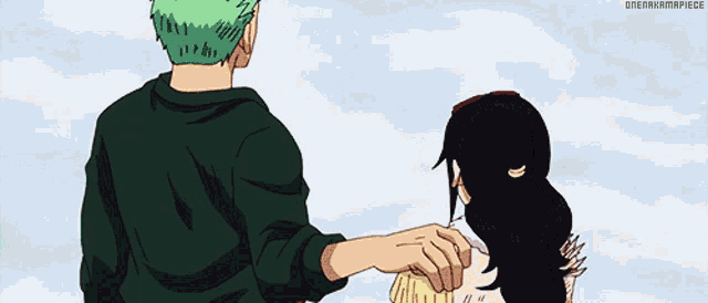 a man with green hair is holding a woman 's hand while standing next to each other