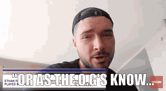 a man wearing a baseball cap with the words " for as the og 's know " on the bottom