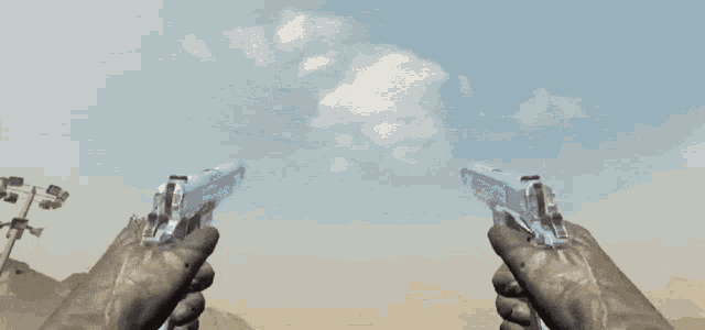 a person holding two guns in their hands with a cloudy sky in the background