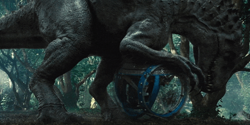 a dinosaur is standing next to a blue wheel in the woods
