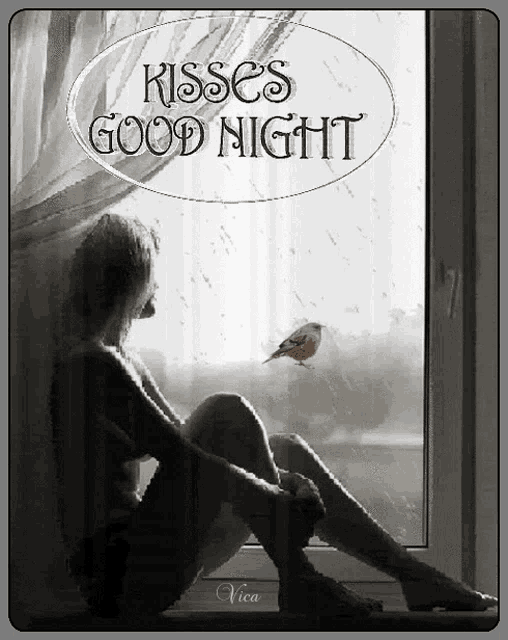 a woman is sitting on a window sill looking out a window with the words kisses good night
