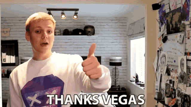 a young man giving a thumbs up with the words thanks vegas behind him