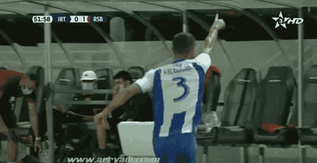 a soccer player with the number 3 on his shirt