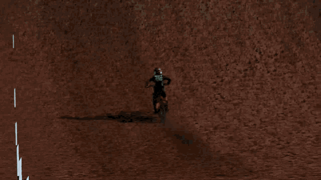 a man riding a bike on top of a hill