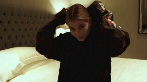 Hailey Baldwin Hoodie GIF - Hailey Baldwin Hoodie Covering GIFs