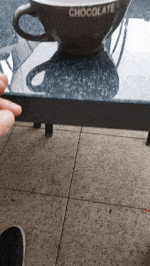 a cup of chocolate sits on a table