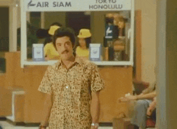 a man in a leopard print shirt is standing in front of a sign that says fair siam