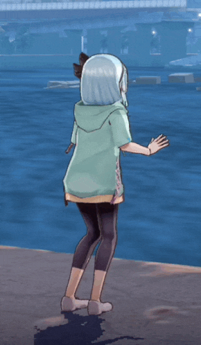a girl in a green hoodie and black leggings is dancing in front of a body of water