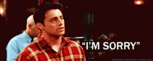 a man says " i 'm sorry " in a plaid shirt