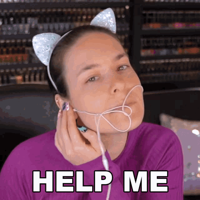 a woman wearing a headband with cat ears is asking for help