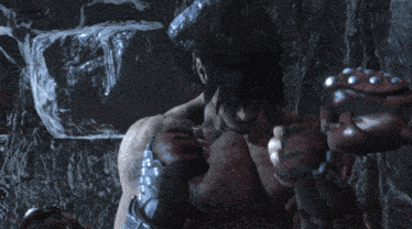 a close up of a person 's chest with a boxing glove on
